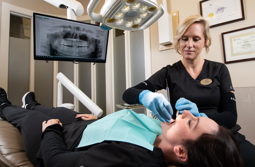 Hygienist with patient